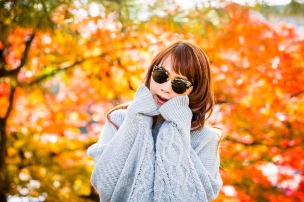 istock Asian woman in autumn 900367462