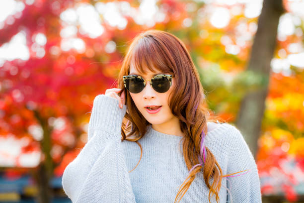 istock Asian woman in autumn 900367464