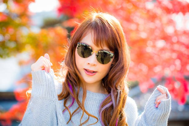 istock Asian woman in autumn 900367498