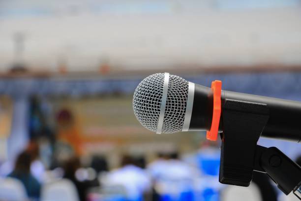 istock microphone on stand Close up in conference room :Select focus with shallow depth of field. 900367848