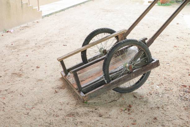istock wooden barrow old two wheel 900374058