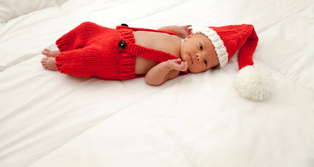 istock Newborn Baby with Santa Hat 900378498