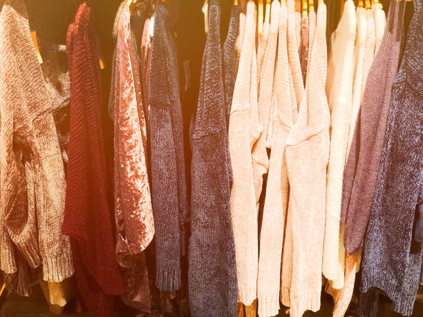 istock Sweaters on the hanger in the store. 900385372
