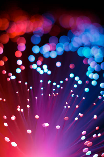 istock Abstract Optic Fiber Pink and Blue Technology Concept Background 900387832