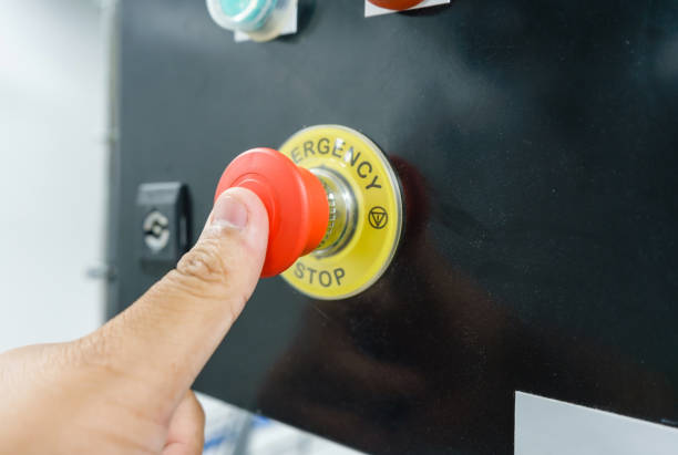 istock Hand pressing the red emergency button or stop button for industrial machine, Emergency Stop for Safety. 900395788
