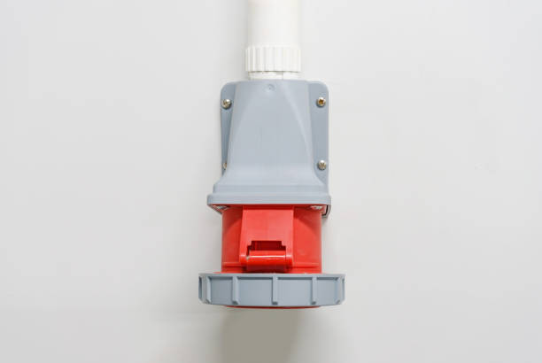istock Industrial high voltage wall-mounted sockets for distributing electrical power on white wall 900396470