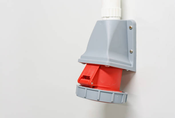 istock Industrial high voltage wall-mounted sockets for distributing electrical power on white wall 900396542