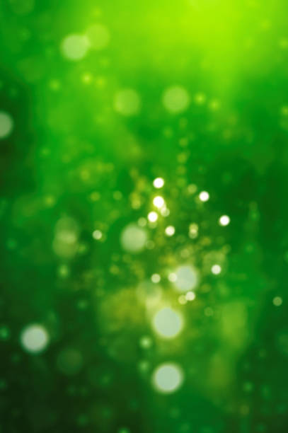 istock Defocused green background with light spots 900399958