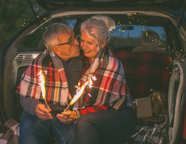 istock Senior couple outdoors with car 900405148