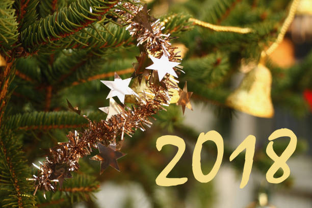 istock New year 2018 with ornaments on Christmas tree 900405150