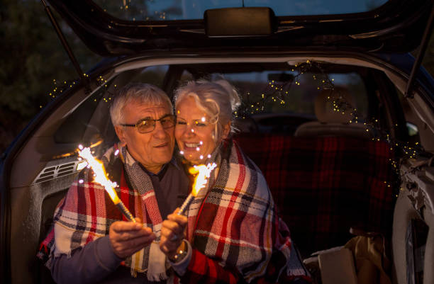 istock Senior couple outdoors with car 900405348