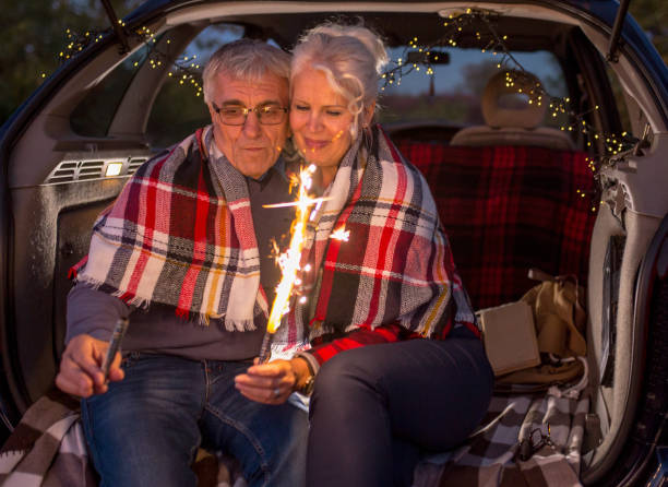 istock Senior couple outdoors with car 900407482