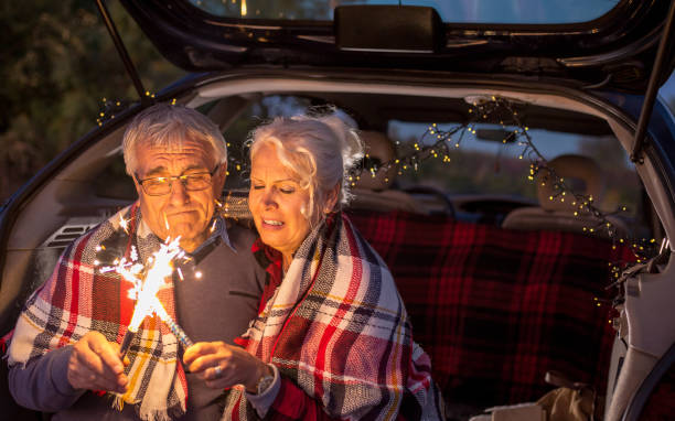 istock Senior couple outdoors with car 900407556
