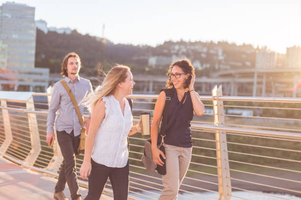 istock People Walking on Pedestrian Bridge in the City 900408024