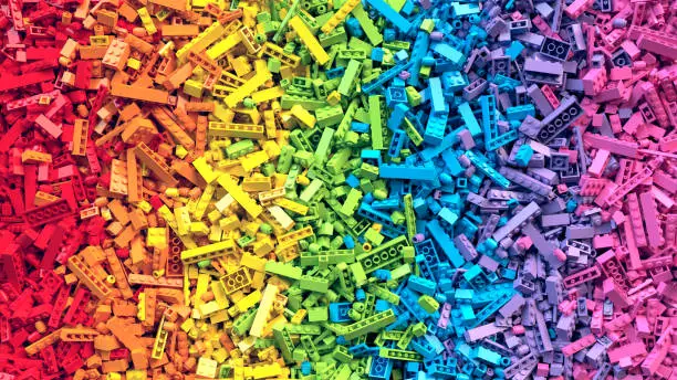 Photo of Rainbow toy blocks background. 3D Rendering