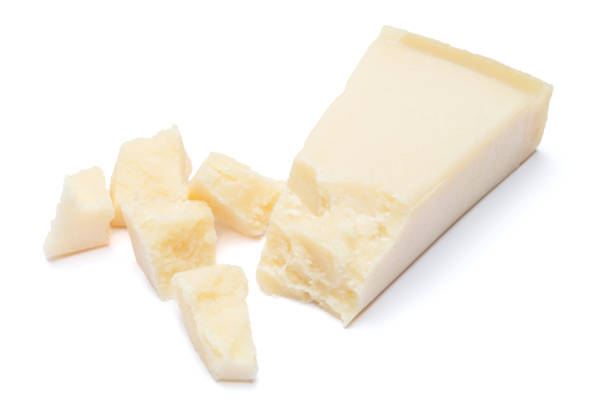 istock pieces of Parmesan cheese on white background 900411966