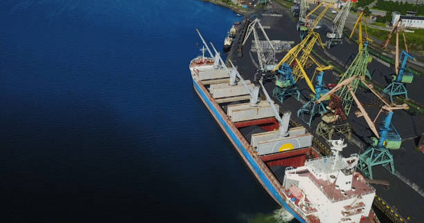 istock Cargo Ship in the Port Aerial View from Drone 900420614
