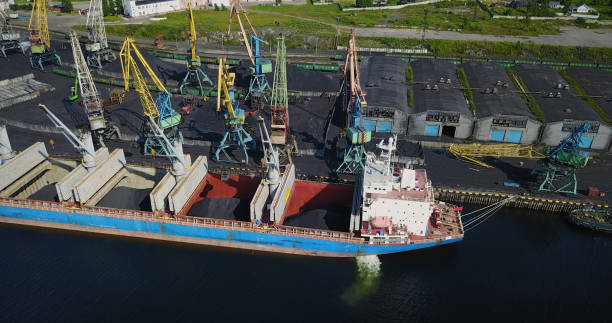 istock Cargo Ship in the Port Aerial View from Drone 900420624