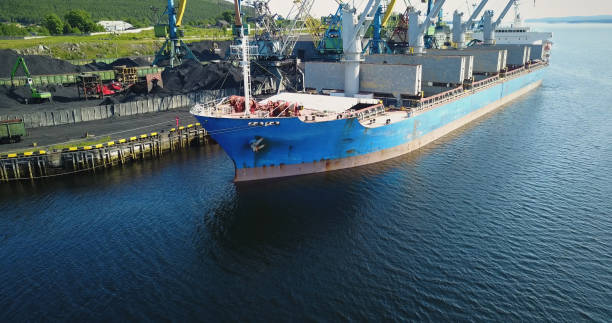 istock Cargo Ship in the Port Aerial View from Drone 900420724