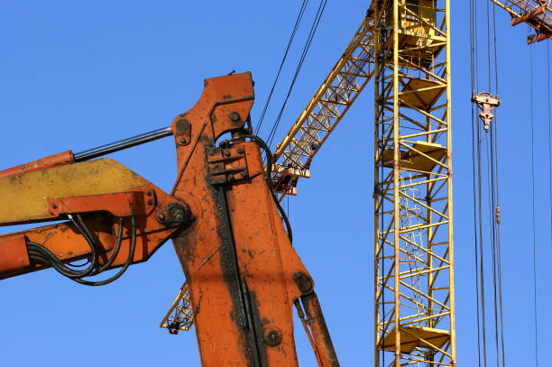 istock Construction machinery, high and heavy construction machinery  on the sky with clouds 900423506