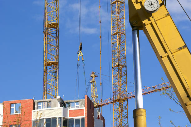 istock Construction machinery, high and heavy construction machinery  on the sky with clouds 900423520