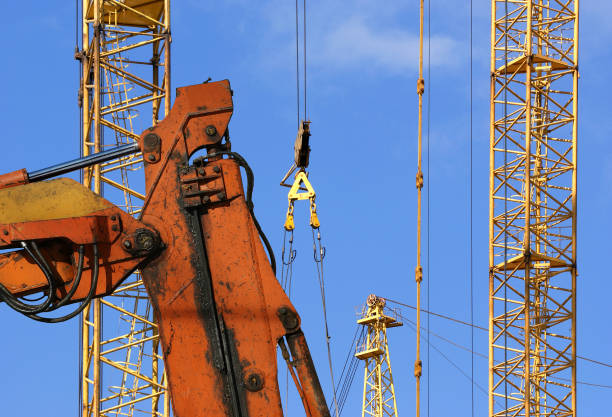 istock Construction machinery, high and heavy construction machinery  on the sky with clouds 900423568