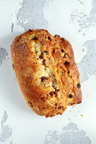 istock Rustic hand made organic bloomer bread with cranberry, raisin and cashew 900427528