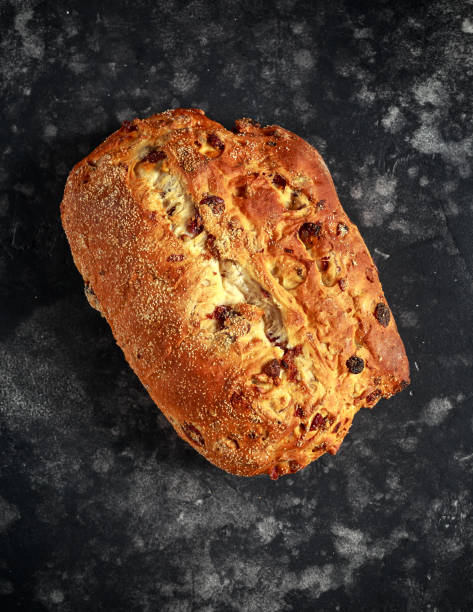 istock Rustic hand made organic bloomer bread with cranberry, raisin and cashew 900427588