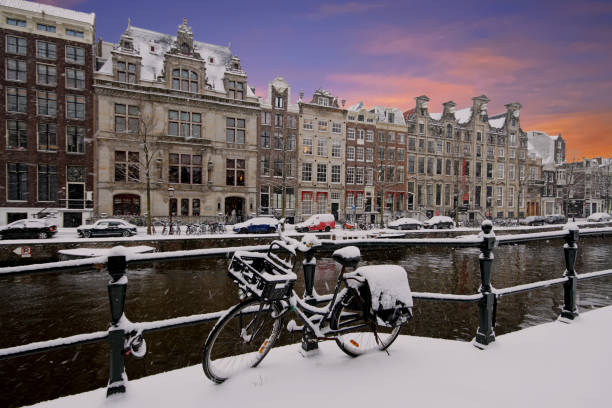 istock Amsterdam covered with snow  in winter in the Netherlands at sunset 900428372