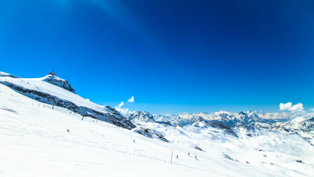 istock sunny day on the ski slopes of Cervinia 900428672