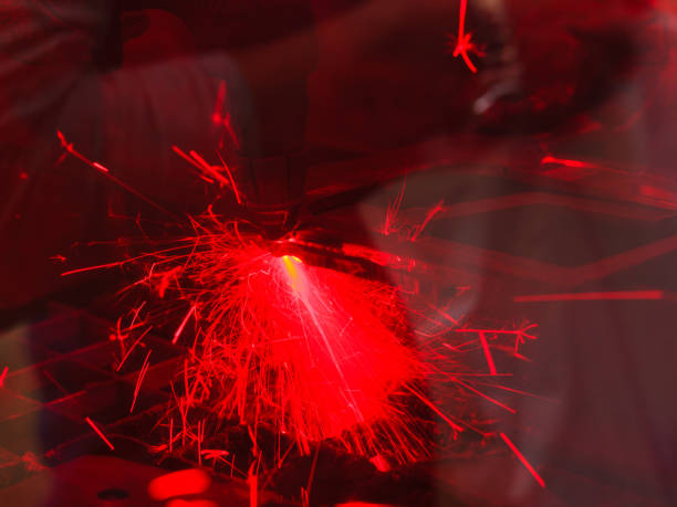 istock Laser cutting steel metal with bright sparks 900431078