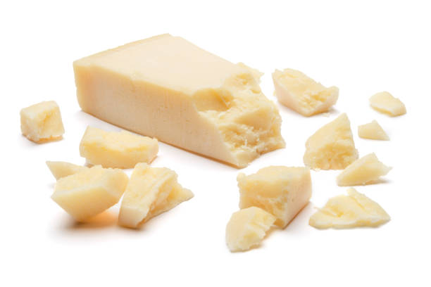 istock pieces of Parmesan cheese on white background 900431084