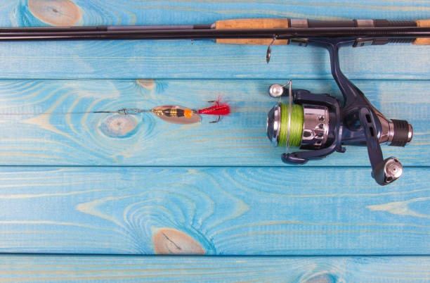 istock Fishing equipment. Spinning method. A place for an inscription. 900431488