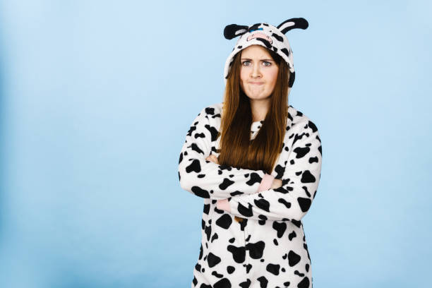 istock Woman wearing pajamas cartoon angry expression 900431956