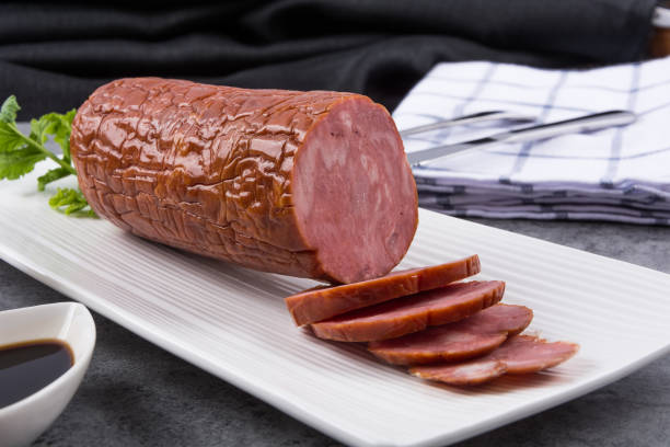 istock Sausage it is isolated on a white background 900438848