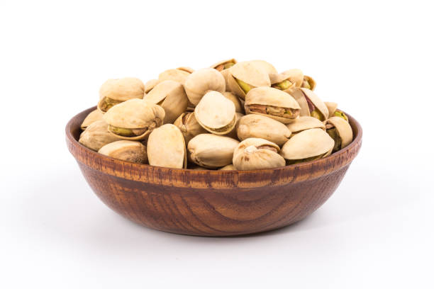 istock Pistachio nuts. Isolated on a white background. 900438902