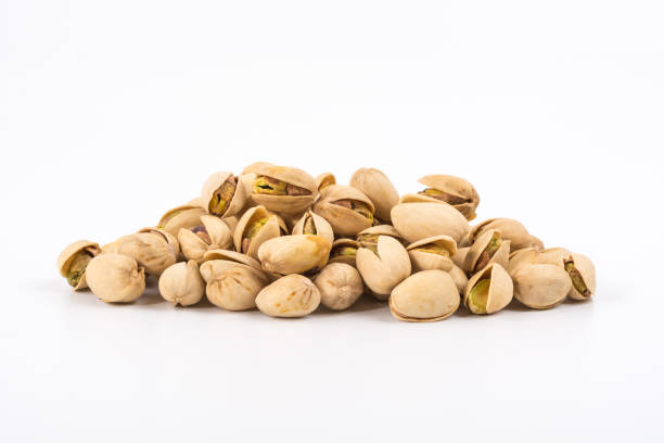istock Pistachio nuts. Isolated on a white background. 900438924