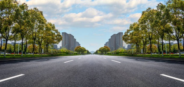 istock Asphalt road and modern city 900439316