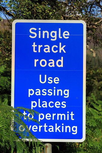 Single track road use passing places sign