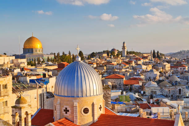 view on n rooftops of Old City of Jerusalem A view on rooftops of Old City of Jerusalem. Grey dome of Church of Our Lady of the Spasm (Armenian church) and golden Dome of the Rock. tetanospasmin stock pictures, royalty-free photos & images