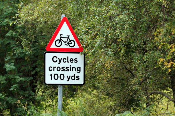 istock Cycles crossing 100 yards warning sign 900444036