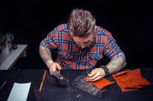 istock Shoemaker piercing leather product for a shoe 900450744