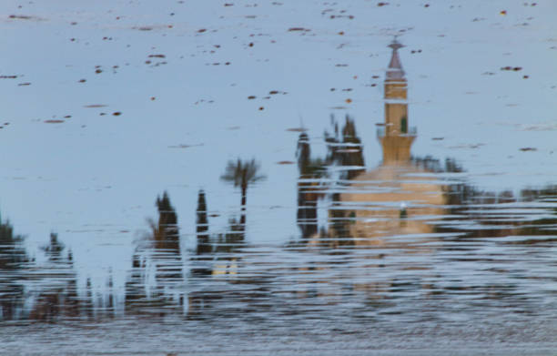 Beautiful reflection of Hala Sultan Tekke on Larnaca Salt Lake in Cyprus on a winter morning