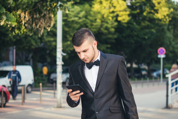 istock Young businessman holding tablet and going to work place 900464324