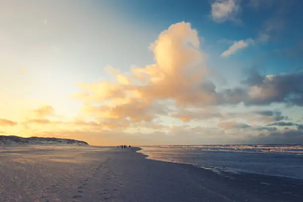 Yellow sunlight over the beach at dusk on east Frisian island