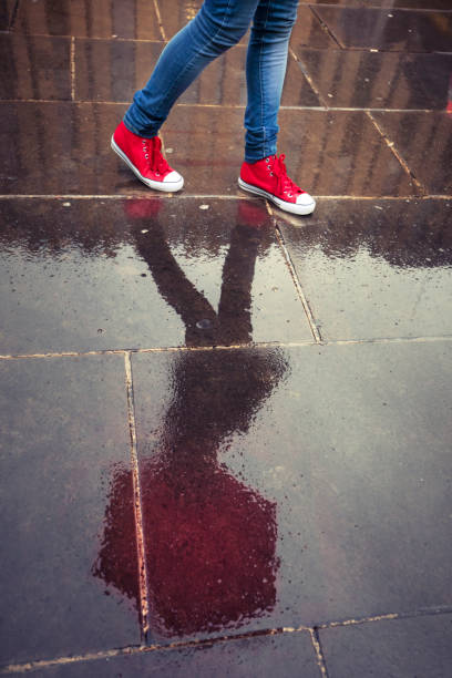 istock Legs of a young woman and her reflection 900482658