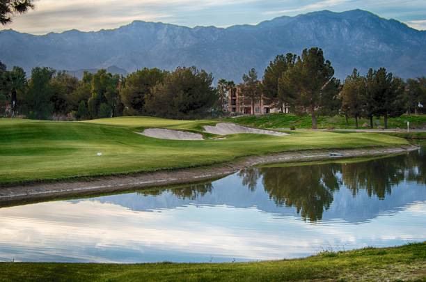 Beautiful Day on the Golf Course_HDR Palm Desert resort golf course. Beautiful view of the mountains reflecting on the pond with the green & flag in the background. palm desert pool stock pictures, royalty-free photos & images