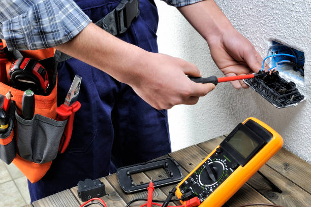 istock Young electrician working in a residential electrical installation 900496620