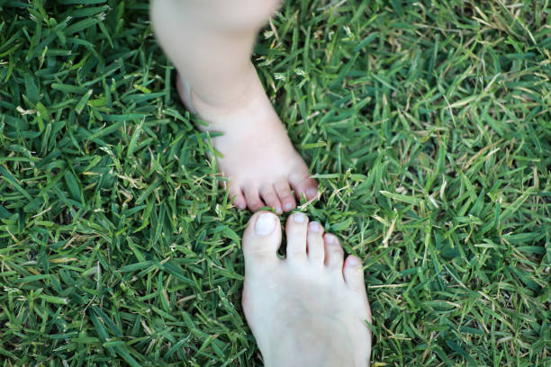 istock Father and Son Feet 900505732