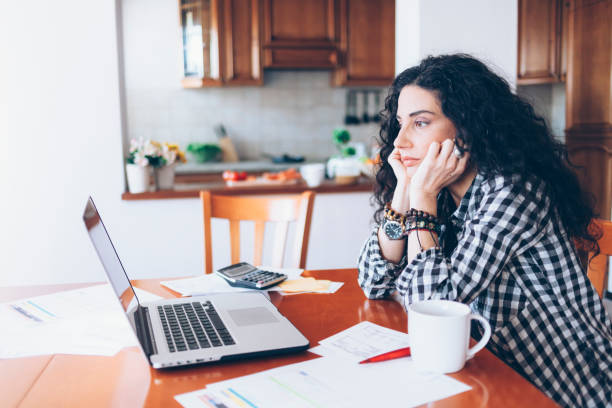 istock Young woman drinking coffee at home 900505984